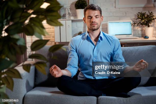 meditation - businessman meditating stock pictures, royalty-free photos & images