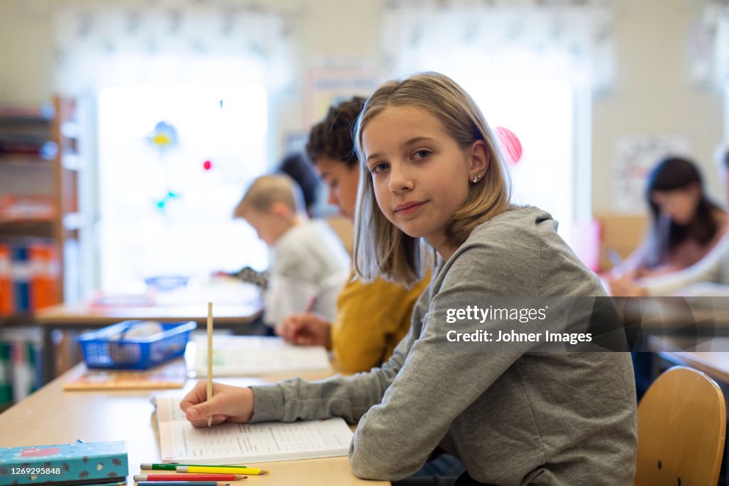 Girl In Classroom High-Res Stock Photo - Getty Images