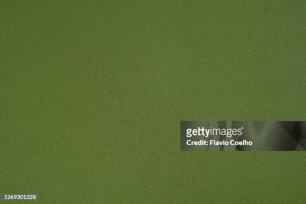 top view of green plastic surface background texture - laminiertes plastik stock-fotos und bilder