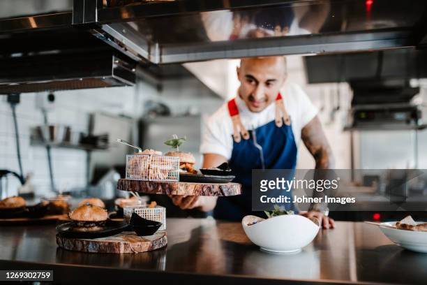 chef working in kitchen - johner images bildbanksfoton och bilder