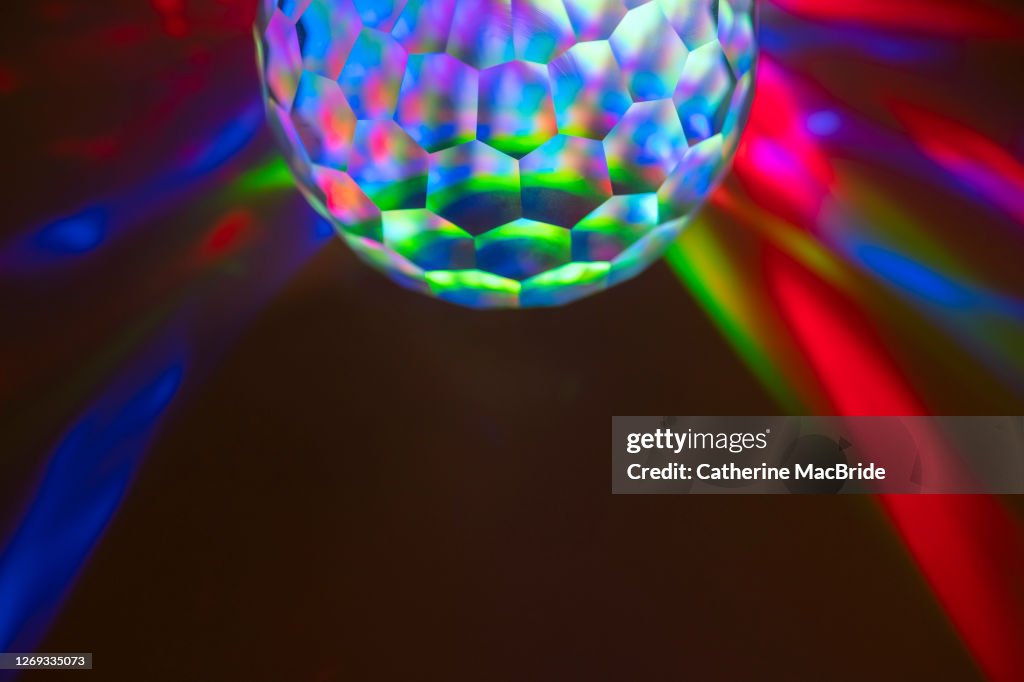 Coloured Light Through A Multi Faceted Crystal