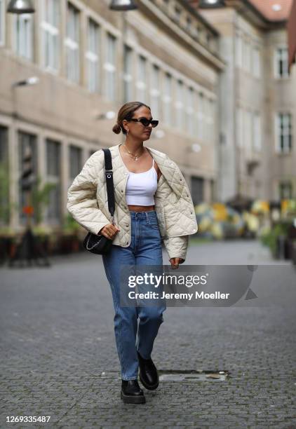 Anna Winter wearing Levis jeans, Prada bag and boots, Weekday jacket and Valentino shades on August 27, 2020 in Berlin, Germany.