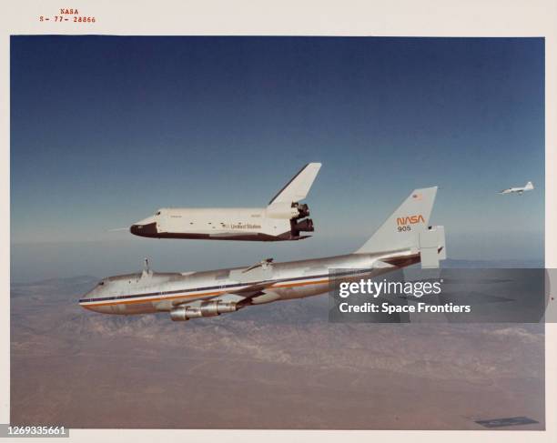 Space Shuttle Enterprise is seen separating from NASA 905, a 747 carrier aircraft, at the start of its first 'tail cone off' unpowered flight over...