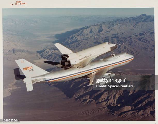 Space Shuttle Enterprise rides piggyback atop NASA 905, a 747 carrier aircraft, at the start of its first 'tail cone off' unpowered flight over the...