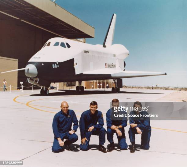 The two crews for the Space Shuttle Approach and Landing Tests pose with the Space Shuttle Enterprise in the background on the day of the Orbiter's...