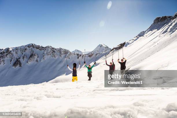 group of happy friends on a ski tour in winter, achenkirch, austria - happy skier stockfoto's en -beelden