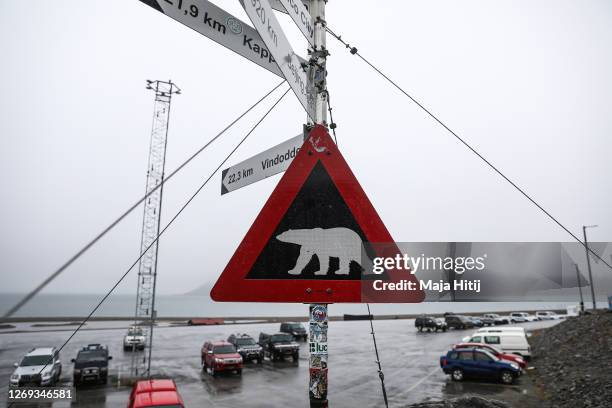 Sign warns of the danger of polar bears near the airport close to a campground where a man was killed by a polar bear on Svalbard archipelago on...