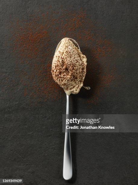 ice cream on spoon - chocolat texture stock-fotos und bilder