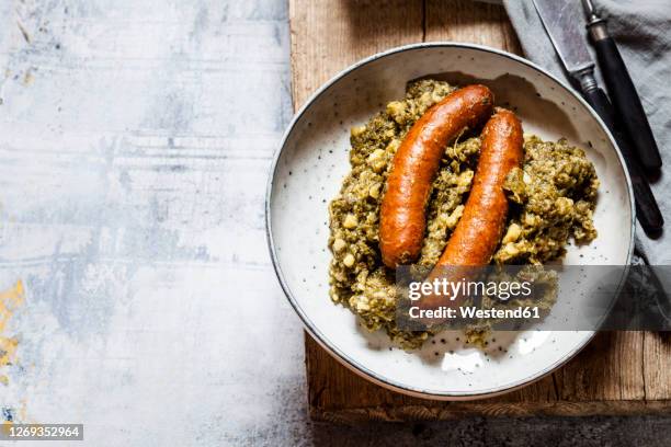 plate of smoked sausages with kale - german food stock pictures, royalty-free photos & images