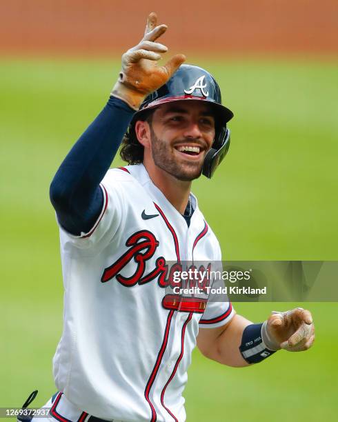 Dansby Swanson of the Atlanta Braves reacts as he crosses the plate after hitting a two run home run in the third inning of game one of the MLB...