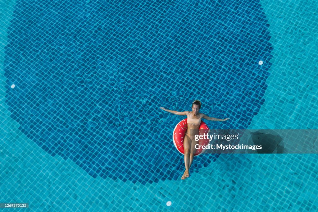 Woman In Inflatable Raft Drone View Of Woman Floating On Inflatable Raft In Swimming Pool High ...