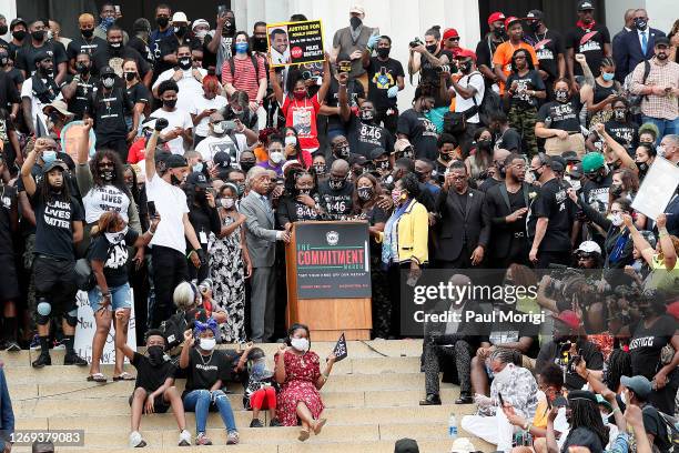 Rev. Al Sharpton , Bridgett Floyd and Philonise Floyd , siblings of George Floyd, and Rep. Sheila Jackson Lee stand at the podium at the 2020 March...