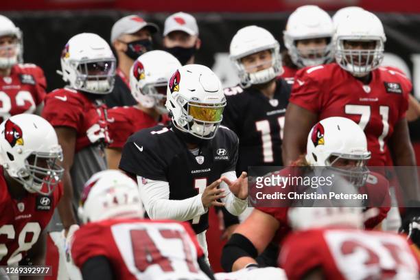 Quarterback Kyler Murray of the Arizona Cardinals prepares to take a snap during the Red & White Practice at State Farm Stadium on August 28, 2020 in...