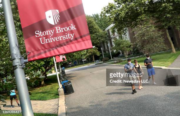 Students walk through the Stony Brook University campus on August 27. 2020. This was the first week of the fall semester.