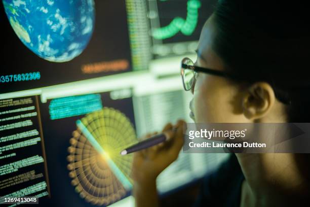 ecology data screen woman - scrutiny stock pictures, royalty-free photos & images