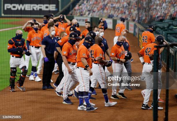 Houston Astros walk off the field before playing the Oakland Athletics as both teams elected not to play in protest of racial injustice and the...
