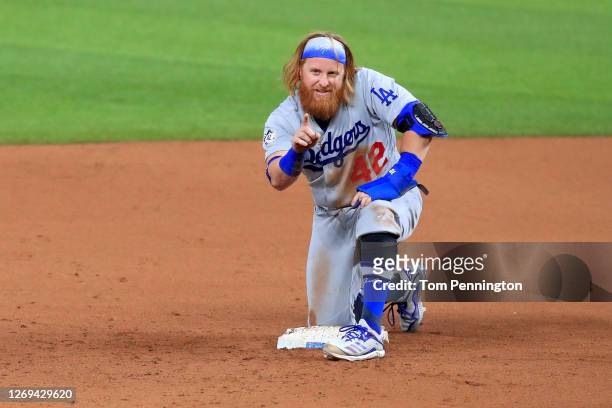 Justin Turner of the Los Angeles Dodgers reacts after stealing second base against the Texas Rangers in the top of the seventh inning at Globe Life...