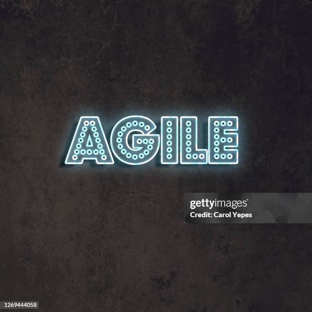 agile single word in neon lights - tech scrum stock pictures, royalty-free photos & images