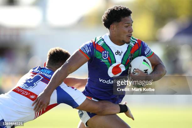 Hayze Perham of the Warriors makes a break during the round 16 NRL match between the New Zealand Warriors and the Newcastle Knights at Scully Park on...