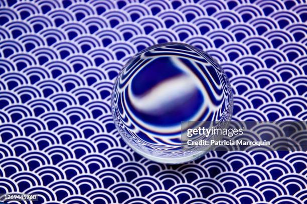 blue graphic crystal ball - looking through lens stock pictures, royalty-free photos & images