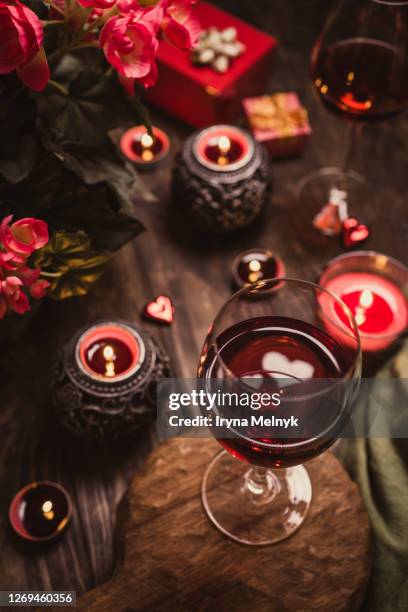 romantic still life with red wine in glass. - valentines day dinner foto e immagini stock