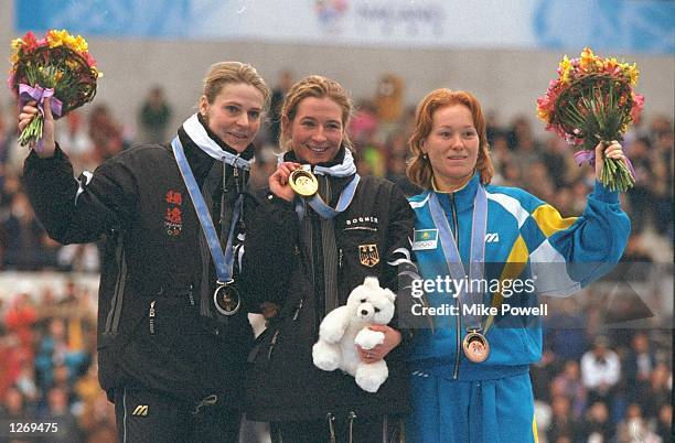 Gunda Niemann-Stirnemann of Germany wins the silver medal, Claudia Pechstein of Germany wins the gold medal and Lyudmila Prokasheva of Kazakstan wins...
