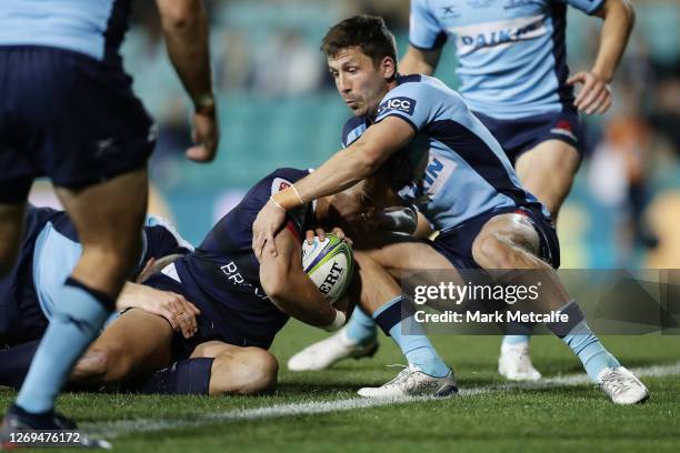 Matt Toomua of the Rebels scores a try during the round nine Super Rugby AU match between the Waratahs and the Melbourne Rebels at Leichhardt Oval on...