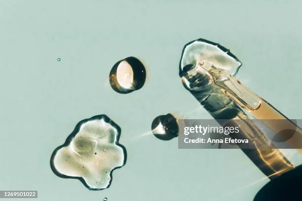 pipette and drops of lotion - face mask beauty product stock pictures, royalty-free photos & images