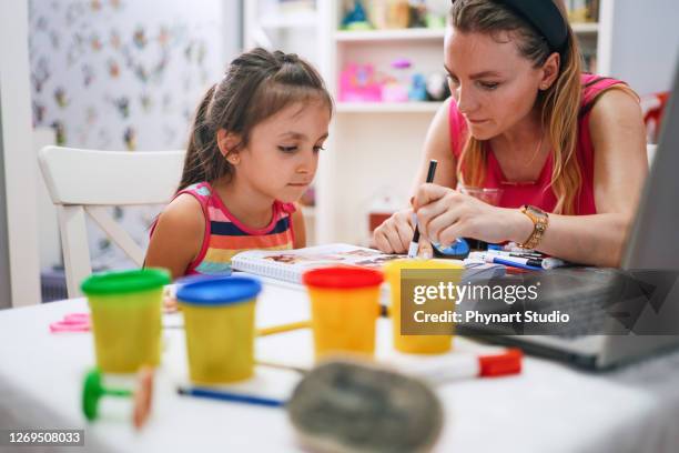 little girl during private lesson - baby sitting studio stock pictures, royalty-free photos & images