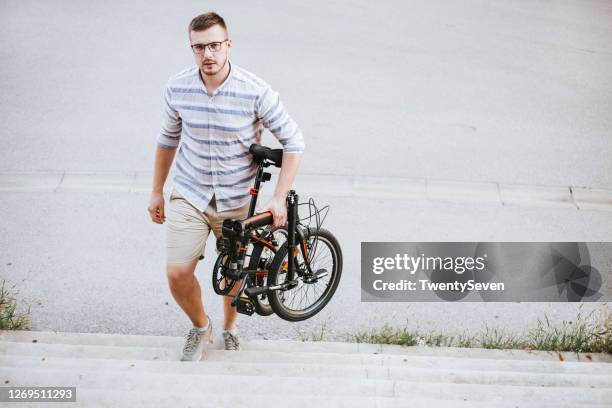 con mi bicicleta plegable - foldable fotografías e imágenes de stock