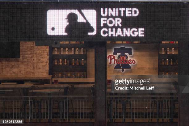 Detail view of MLB LED logo with slogan "United For Change" in the outfield at Citizens Bank Park prior to the game between the Atlanta Braves and...