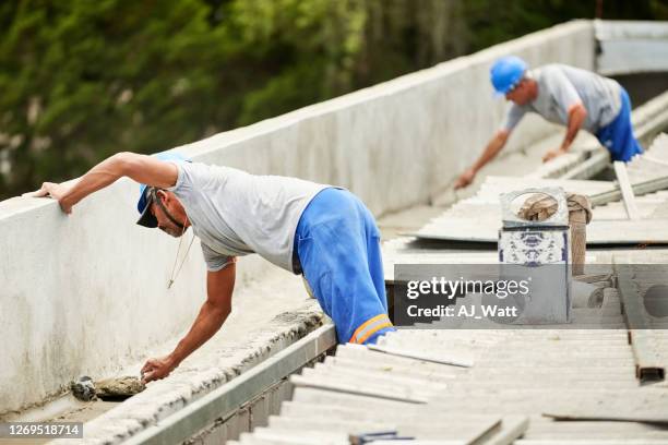 finishing the roof work - leaky roof stock pictures, royalty-free photos & images