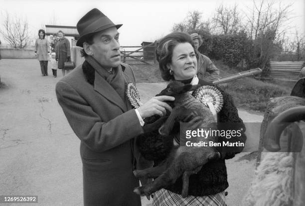 Liberal Party Leader Jeremy Thorpe with wife Marion Stein holding a baby sheep in Devonshire, England, February 1974.