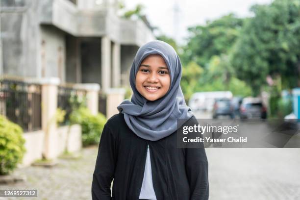 muslim girl portrait - indonesian girl stock pictures, royalty-free photos & images