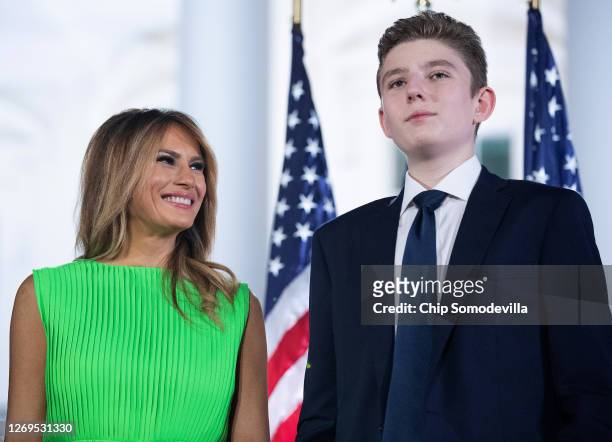 First lady Melania Trump looks at her son Barron Trump after U.S. President Donald Trump delivered his acceptance speech for the Republican...