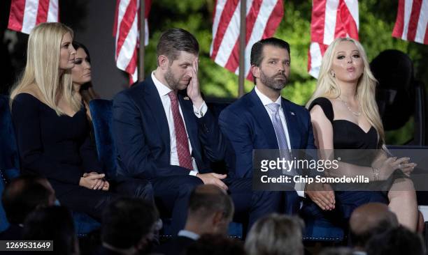President Donald Trump's children, Ivanka Trump, Eric Trump, Donald Trump Jr. And Tiffany Trump, sit on the stage as their father delivers his...
