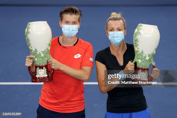 Demi Schuurs of the Netherlands and Kveta Peschke of the Czech Republic pose with the trophy after winning their Women's Doubles Final match in the...