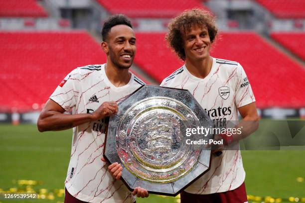 Pierre-Emerick Aubameyang and David Luiz of Arsenal celebrate with the Community Shield Trophy following his team's victory in the FA Community...