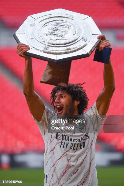 Mohamed Elneny of Arsenal celebrates with the Community Shield Trophy following his team's victory in the FA Community Shield final between Arsenal...