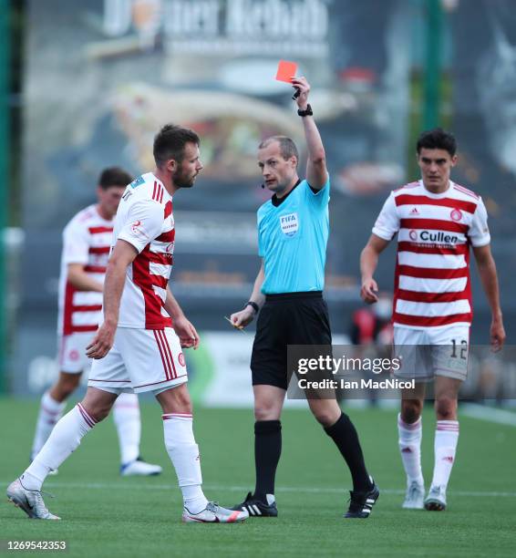 Scott McMann of Hamilton is sent off by referee William Collum during the Ladbrokes Scottish Premiership match between Hamilton Academical and...