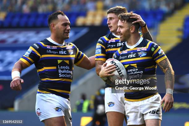 Richie Myler of Leeds Rhinos celebrates with team mates after scoring a try during the Betfred Super League match between Leeds Rhinos and Salford...