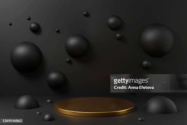 golden podium on black background with spheres. - winners podium stockfoto's en -beelden