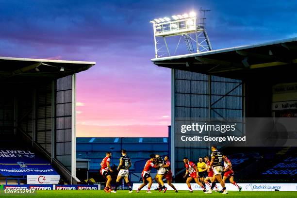 General view of play as the sun sets behind the stand during the Betfred Super League match between Leeds Rhinos and Salford Red Devils at The...