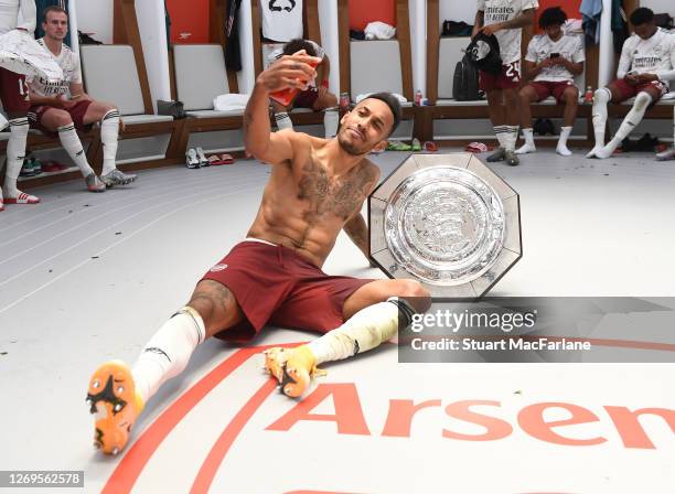 Pierre-Emerick Aubameyang takes a selfie with the Community Shield after the FA Community Shield match between Arsenal and Liverpool at Wembley...