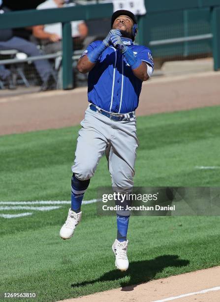 Maikel Franco of the Kansas City Royals leaps in celebration as he runs the bases after hitting a three run home run in the 7th inning against the...