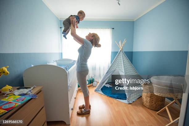 motherly love. - baby blue stock pictures, royalty-free photos & images