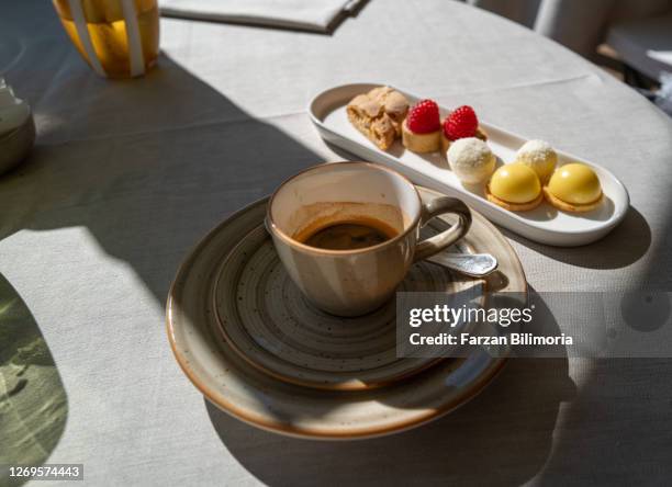 petit fours after lunch with espresso - portofino stock pictures, royalty-free photos & images