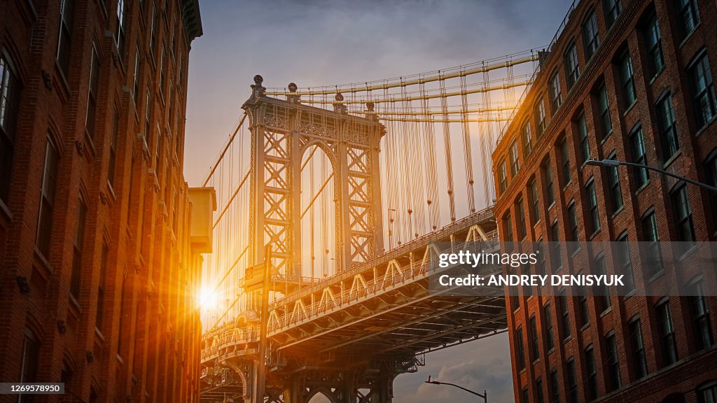 Manhattan Bridge at Sunset. Classic View of Famous International Landmark. Sunbeam.