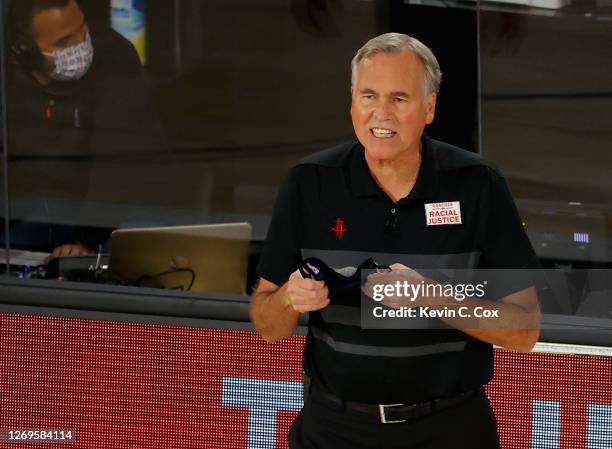 Mike D'Antoni of the Houston Rockets yells to his team against the Oklahoma City Thunder during the fourth quarter in Game Five of the Western...