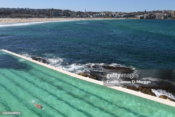 Swimmer enjoys Icebergs pool at Bondi Beach on August 30, 2020 in Sydney, Australia. Warm winter weather is being enjoyed across the entire Sydney...